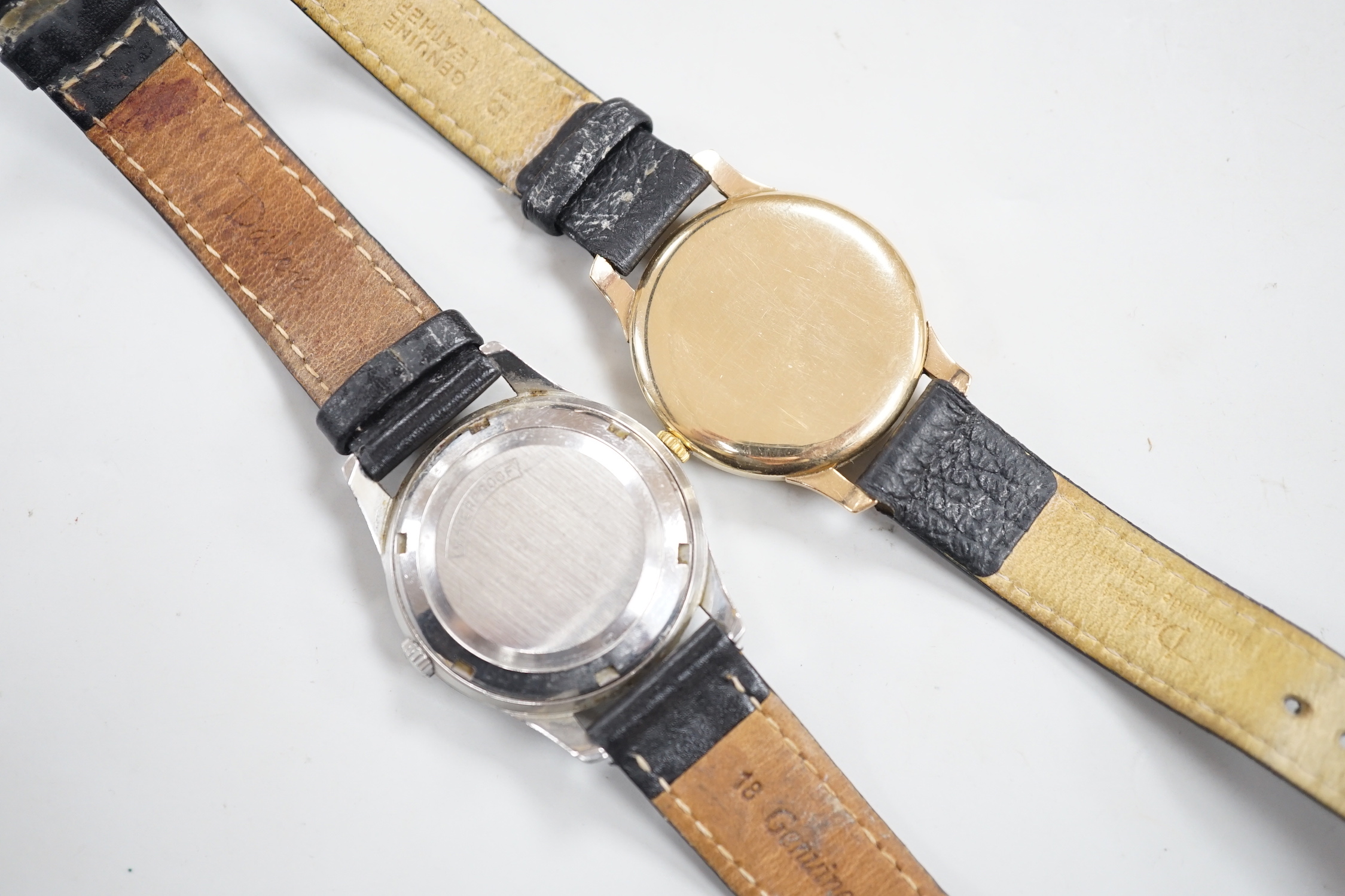 A gentleman's 9ct gold Girard Perregaux manual wind wrist watch, on associated leather strap and a gentleman's stainless steel Tissot Seastar automatic wrist watch.